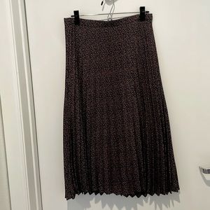J. Crew mid-length pleated skirt. Navy with neutral pattern. Size 4.